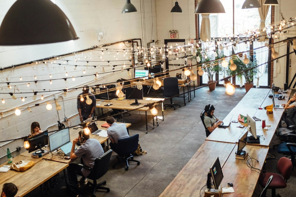 large open office with many tables for group working